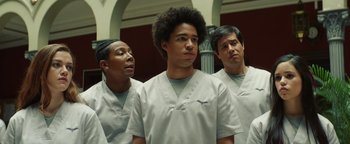 Movie still from “American Carnage” (2022), directed by Diego Hallivis – A group of men standing next to each other; Medium shot, Low angle