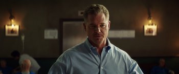 Movie still from “American Carnage” (2022), directed by Diego Hallivis – A person wearing a blue shirt; Close Up shot, Low angle