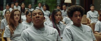 Movie still from “American Carnage” (2022), directed by Diego Hallivis – A group of young people sitting in front of each other; Close Up shot, Low angle