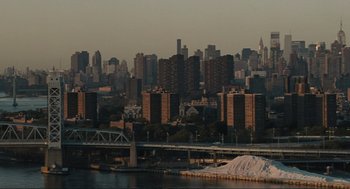 Movie still from “American Gangster” (2007), directed by Ridley Scott – A view of a city skyline from across the river; Extreme Wide shot, High angle