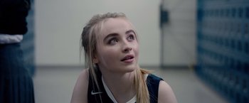 Movie still from “The Hate U Give” (2018), directed by George Tillman Jr. – A young woman looking up into the air; Close Up shot, Over the shoulder angle