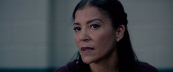 Movie still from “The Hate U Give” (2018), directed by George Tillman Jr. – A person looking at the camera; Close Up shot, Over the shoulder angle