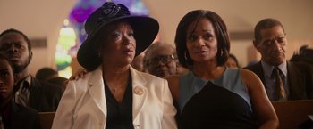 Movie still from “The Hate U Give” (2018), directed by George Tillman Jr. – A couple of women standing next to each other in a room; Close Up shot, Low angle