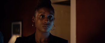 Movie still from “The Hate U Give” (2018), directed by George Tillman Jr. – A person wearing a jacket; Close Up shot, Over the shoulder angle