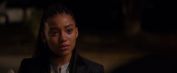 Movie still from “The Hate U Give” (2018), directed by George Tillman Jr. – A person wearing a jacket; Close Up shot, Over the shoulder angle