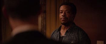 Movie still from “The Hate U Give” (2018), directed by George Tillman Jr. – A person wearing a black shirt; Close Up shot, Over the shoulder angle