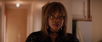 Movie still from “The Hate U Give” (2018), directed by George Tillman Jr. – A person wearing a necklace; Close Up shot, Over the shoulder angle