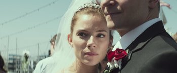 Movie still from “American Sniper” (2014), directed by Clint Eastwood – A woman in a wedding dress with a veil on her head; Close Up shot, Low angle