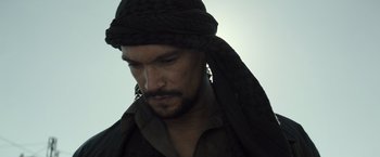 Movie still from “American Sniper” (2014), directed by Clint Eastwood – A person wearing a turban; Close Up shot, Low angle