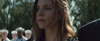 Movie still from “American Sniper” (2014), directed by Clint Eastwood – A person with long brown hair; Close Up shot, Low angle