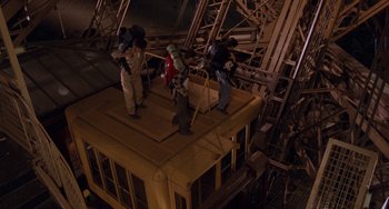 Movie still from “An American Werewolf in Paris” (1997), directed by Anthony Waller – A group of people standing on top of a building; Wide shot, High angle