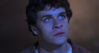 Movie still from “An American Werewolf in Paris” (1997), directed by Anthony Waller – A person looking up at the sky; Close Up shot, Low angle