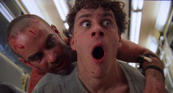 Movie still from “An American Werewolf in Paris” (1997), directed by Anthony Waller – A man and a boy with blood all over their faces; Close Up shot, Low angle