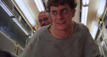 Movie still from “An American Werewolf in Paris” (1997), directed by Anthony Waller – A man with blood all over his face; Close Up shot, Low angle