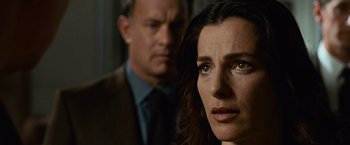 Movie still from “Angels & Demons” (2009), directed by Ron Howard – A woman and a man standing next to each other in a room; Close Up shot, Over the shoulder angle