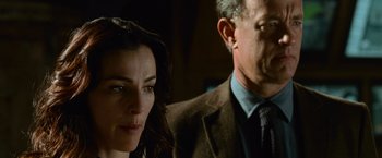 Movie still from “Angels & Demons” (2009), directed by Ron Howard – A man and a woman standing next to each other; Close Up shot, Over the shoulder angle