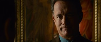 Movie still from “Angels & Demons” (2009), directed by Ron Howard – A person wearing a suit and tie; Close Up shot, Over the shoulder angle