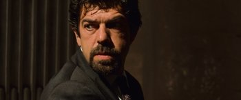 Movie still from “Angels & Demons” (2009), directed by Ron Howard – A person wearing a suit and tie; Close Up shot, Low angle