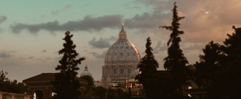Movie still from “Angels & Demons” (2009), directed by Ron Howard – The dome of a church is lit up at dusk; Extreme Wide shot, Low angle