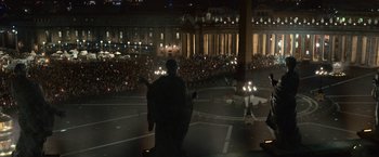 Movie still from “Angels & Demons” (2009), directed by Ron Howard – A crowd of people are gathered in the dark; Extreme Wide shot, High angle