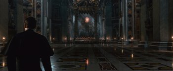 Movie still from “Angels & Demons” (2009), directed by Ron Howard – A large room with many candles in the middle of the floor; Extreme Wide shot, Low angle