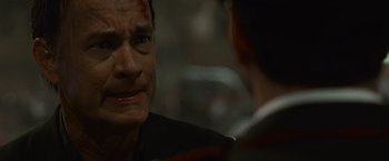 Movie still from “Angels & Demons” (2009), directed by Ron Howard – A man with blood all over his face is talking to another man; Close Up shot, Over the shoulder angle