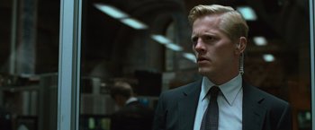 Movie still from “Angels & Demons” (2009), directed by Ron Howard – A person wearing a suit and tie; Close Up shot, Low angle