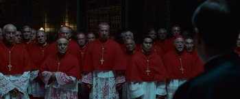 Movie still from “Angels & Demons” (2009), directed by Ron Howard – A group of men standing next to each other wearing robes; Wide shot, High angle