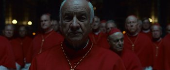 Movie still from “Angels & Demons” (2009), directed by Ron Howard – A group of men in red robes standing next to each other; Close Up shot, Low angle
