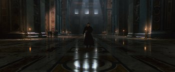 Movie still from “Angels & Demons” (2009), directed by Ron Howard – A man standing in the middle of an empty room; Extreme Wide shot, High angle