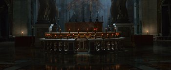 Movie still from “Angels & Demons” (2009), directed by Ron Howard – A large church with a lot of candles lit; Extreme Wide shot, High angle