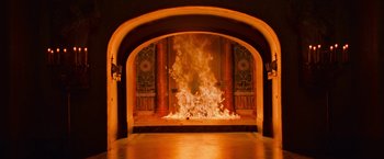 Movie still from “Angels & Demons” (2009), directed by Ron Howard – An open fire place in an ornate room with pillars; Extreme Wide shot, High angle