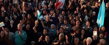 Movie still from “Angels & Demons” (2009), directed by Ron Howard – A large group of people are gathered in a stadium; Extreme Wide shot, High angle