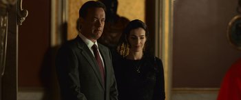 Movie still from “Angels & Demons” (2009), directed by Ron Howard – A man and a woman standing next to each other; Medium shot, Low angle