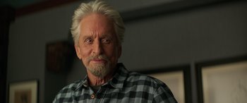 Movie still from “Ant-Man and the Wasp: Quantumania” (2023), directed by Peyton Reed – An older man with white hair is smiling; Close Up shot, Low angle