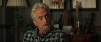 Movie still from “Ant-Man and the Wasp: Quantumania” (2023), directed by Peyton Reed – An older man with white hair and a gray beard; Close Up shot, Over the shoulder angle