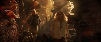 Movie still from “Ant-Man and the Wasp: Quantumania” (2023), directed by Peyton Reed – A woman and a man are walking through a forest; Wide shot, Low angle