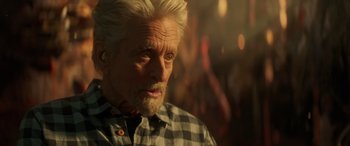 Movie still from “Ant-Man and the Wasp: Quantumania” (2023), directed by Peyton Reed – An older man with white hair looking at the camera; Close Up shot, Over the shoulder angle