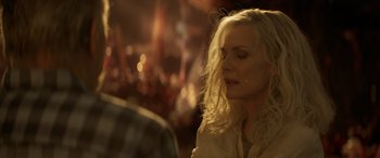 Movie still from “Ant-Man and the Wasp: Quantumania” (2023), directed by Peyton Reed – A woman with long blonde hair sitting in front of a table; Close Up shot, Over the shoulder angle