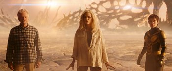 Movie still from “Ant-Man and the Wasp: Quantumania” (2023), directed by Peyton Reed – A woman standing in front of an alien landscape; Medium shot, High angle