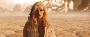 Movie still from “Ant-Man and the Wasp: Quantumania” (2023), directed by Peyton Reed – A woman with long blonde hair wearing a white shirt; Medium shot, Low angle