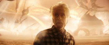 Movie still from “Ant-Man and the Wasp: Quantumania” (2023), directed by Peyton Reed – An old man with a white beard is looking into the distance; Medium shot, Over the shoulder angle