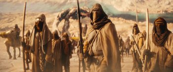 Movie still from “Ant-Man and the Wasp: Quantumania” (2023), directed by Peyton Reed – A group of people standing in the desert; Wide shot, Low angle