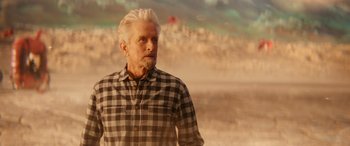 Movie still from “Ant-Man and the Wasp: Quantumania” (2023), directed by Peyton Reed – An older man standing on the beach looking off into the distance; Medium shot, Low angle