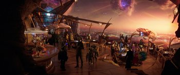 Movie still from “Ant-Man and the Wasp: Quantumania” (2023), directed by Peyton Reed – A group of people standing on top of a building; Extreme Wide shot, High angle