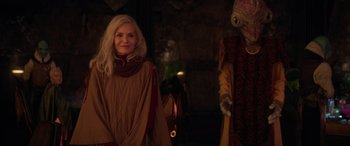 Movie still from “Ant-Man and the Wasp: Quantumania” (2023), directed by Peyton Reed – A woman standing next to a person in a costume; Medium shot, Over the shoulder angle