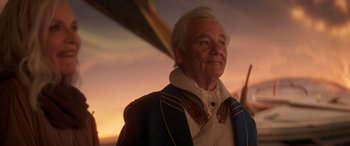 Movie still from “Ant-Man and the Wasp: Quantumania” (2023), directed by Peyton Reed – An older man wearing a suit and a white beard; Close Up shot, Low angle