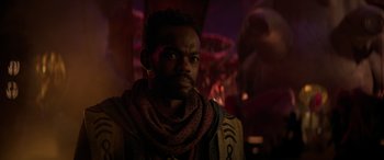 Movie still from “Ant-Man and the Wasp: Quantumania” (2023), directed by Peyton Reed – A man with a beard is looking at the camera; Close Up shot, Over the shoulder angle