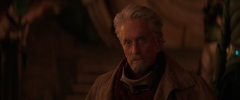 Movie still from “Ant-Man and the Wasp: Quantumania” (2023), directed by Peyton Reed – An older man with white hair and a gray beard; Close Up shot, Over the shoulder angle