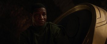 Movie still from “Ant-Man and the Wasp: Quantumania” (2023), directed by Peyton Reed – A person wearing a green shirt; Close Up shot, Over the shoulder angle